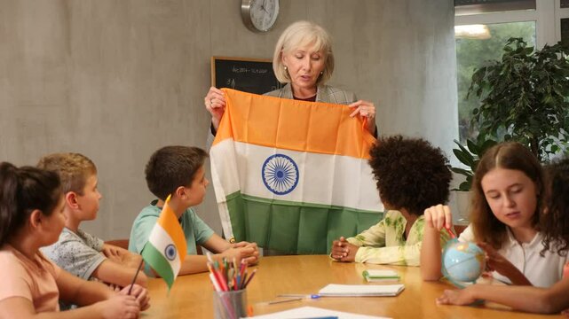 curious students listen attentively to the teacher who tells interesting facts about India