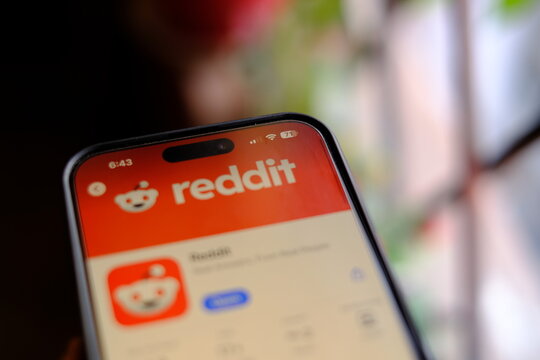 Delhi, India April 11 2025 : reddit app on smartphone, a platform for sharing content, engaging in discussions, and connecting with communities with same interests.