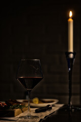 dinner in a restaurant with wine, beautiful table setting, a glass of wine in the foreground