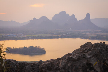 The sunset viewpoint at Phu Sap Lek Reservoir is accessible by walking up a mountain about 300 meters high. You will see the reservoir and the beautiful mountains in the background, Lopburi