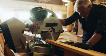 Workshop, man and machine with wood for carpenter, plank manufacturing and production business. Warehouse, mature person and contractor with saw tools for professional service, maintenance or project