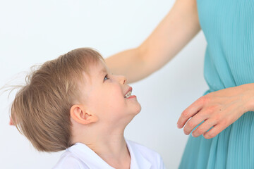 Fototapeta premium Mom's hands and child close-up, boy 4-6 years old, nose game