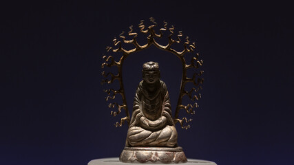 An antique Buddha sculpture in the lotus position, symbolizing enlightenment and nirvana. The stone or bronze statuette, possibly gilded, is displayed in a museum, reflecting Buddhist history and
