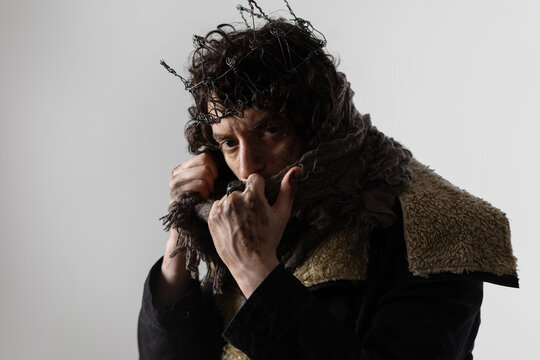 Hamlet in modern grunge or post-apocalyptic reinterpretation, young man, tragic Shakespearean hero in a crown of wire