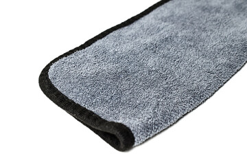 Cleaning cloth isolated, grey or gray, cleaning microfiber towel, wiping cotton napkin, microfibre fabric, kitchen cloths made of natural materials on white background. Close up. Half view.