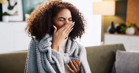 Sneeze, sick and tired with woman on sofa for medical recovery, illness and flu season. Disease,...