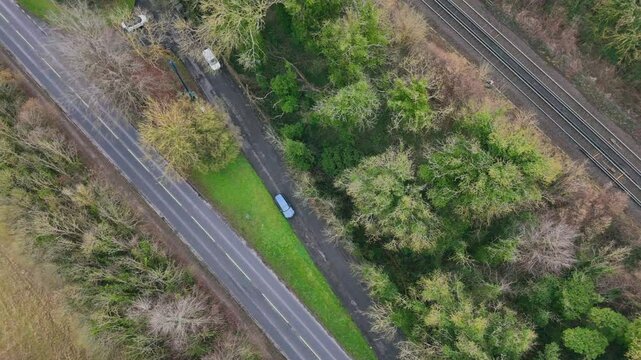 Top down drone footage of the cars driving on the roads of Shoreham village, England, during daytime