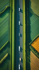 Ultra HD Aerial View of Endless Highway Cutting Through Geometric Farmland in 8K