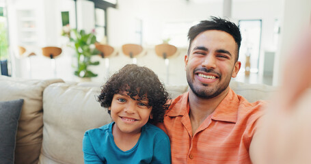 Obraz premium Selfie, dad and bonding with child, home and picture with son in lounge, portrait and smile for memory. Happy, man and care for kid in living room, photography and father with boy in house or relax