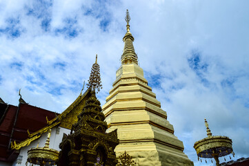 Fototapeta premium Pagoda and Chapel, Lanna architecture at Wat Phra That Cho Han, Phrae, North Thailand