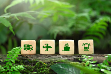 Green logistics and Sustainable transport. wooden blocks with a green icon representing Green transportation by Ship, train, airplane, truck, with clean energy.Concept green transportation environment