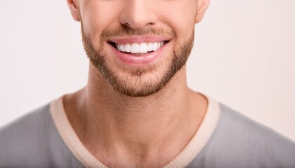 Obraz premium a man's radiant smile showcases perfectly aligned white teeth, and a well-groomed beard