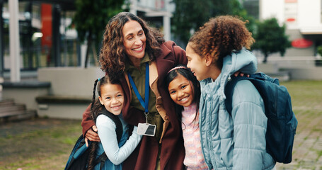 School kids, hug and happy with teacher, outdoor and reunion in city for solidarity, connection or portrait. Children, group and woman with embrace, education and welcome for scholarship at academy
