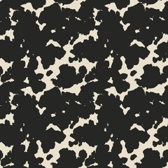 Seamless animal pattern. Cowhide texture with black spots on white. Mammal fur print. Leather design.