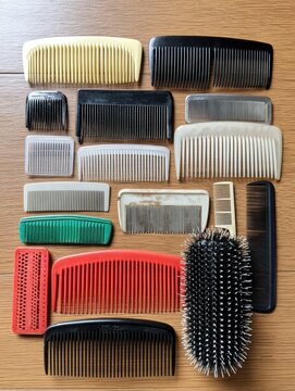 Variety of combs, different sizes and materials, for hair parting, styling, and beard care - wood product comb