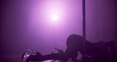 Woman, exotic dancer and flexible with silhouette on floor, stage and creativity with body for concert at night. Person, dance and movement with arch for private show, performance or fantasy at club