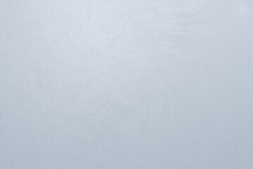 Powder blue concrete rough texture. Light is coming from top