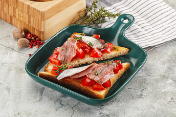 Sandwich with tomato and anchovy