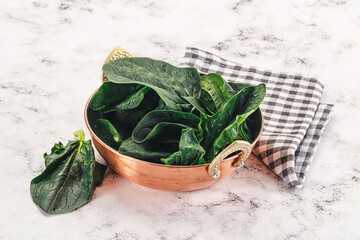 Ripe green spinach leaves heap