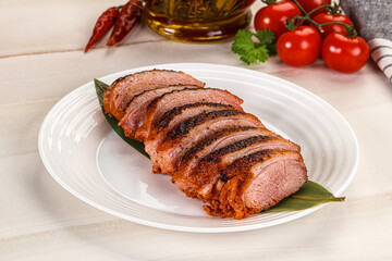 Sliced duck breast baked with cherry