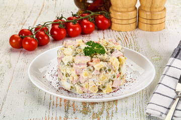 Russian traditional Olivier salad with sausages