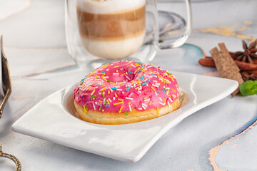 Sweet donut with strawberry icing