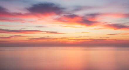Sunset on red yellow sky back soft evening cloud over sea