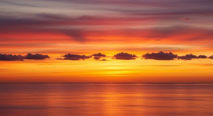 Obraz premium Sunset on red yellow sky back soft evening cloud over sea