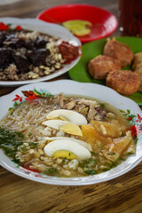 Indonesian soupy dish, captured on April 8, 2025. A rich and aromatic broth served with tender meat, vegetables, and local spices, offering comforting and traditional flavors