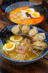 Indonesian-style ramen, captured on April 8, 2025. A savory noodle dish with rich broth, tender...