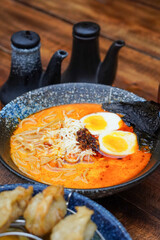 Indonesian-style ramen, captured on April 8, 2025. A savory noodle dish with rich broth, tender...