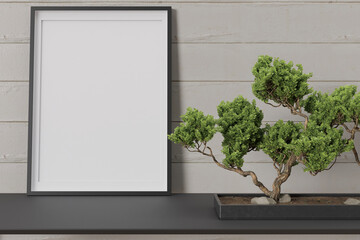 Fototapeta premium Elegant interior showcasing an empty picture frame alongside a beautifully shaped bonsai plant placed on a modern black shelf against a wooden wall, offering a perfect mockup for display. 3D render.