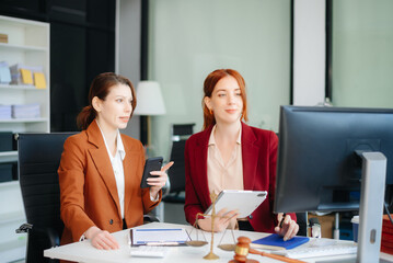 Business and lawyers discussing contract papers with brass scale on desk in office. Law, legal services, advice,  justice and law