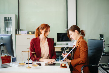 Obraz premium Business and lawyers discussing contract papers with brass scale on desk in office. Law, legal services, advice, justice and law