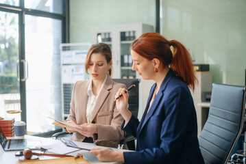  business team and lawyers discussing contract papers sitting at the table. Concepts of law, advice, legal services.