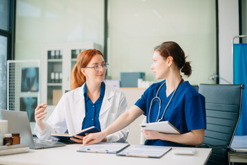 Medical team in hospital using digital tablet for diagnosis, teamwork, and patient care doctor and nurse collaboration