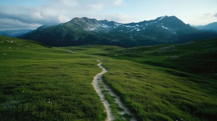 Fototapeta premium Mountain path through green valley