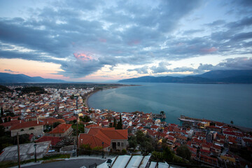 Sunset Over Coastal City and Sea in Greece