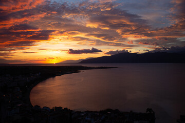 Sunset Over Coastal City and Sea in Greece