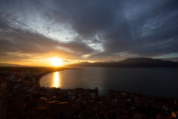 Sunset Over Coastal City and Sea in Greece