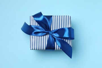 Beautiful gift box on color background