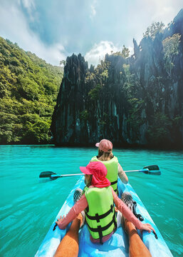 Family summer vacations kayaking in Philippines travel healthy lifestyle active trip, parents and child exploring Palawan island turquoise water lagoon tropical vibes
