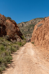 Beautiful scenery with winding gravel dirt road, Costa Blanca , Alicante, Spain - stock photo