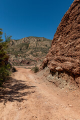 Beautiful scenery with winding gravel dirt road, Costa Blanca , Alicante, Spain - stock photo