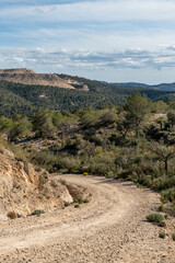 Beautiful scenery with winding gravel dirt road, Costa Blanca , Alicante, Spain - stock photo