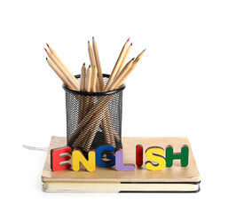 Text LEARN ENGLISH made of wooden letters with stationery isolated on white background