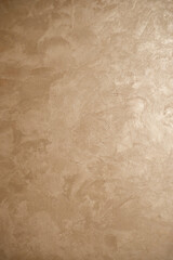 Golden abstract textured wall background with plaster finish