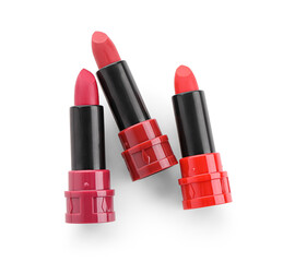 Different new red lipsticks on white background
