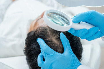 Specialist of hair check health of hair for Asian man, damaged hair, hair loss, thinning problem,...