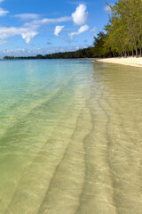Beautiful tropical Mont Choisy Beach, Mauritius Island in indian ocean, blue cloudy sky background